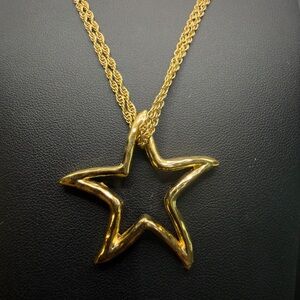 Vintage Givenchy Rare open star pendant on a double gold-tone chain